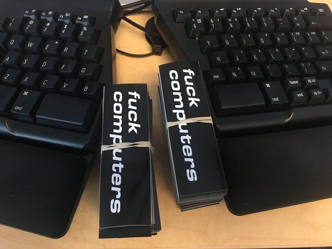 two stacks of 250 stickers, each reading 'fuck computers' in white on black